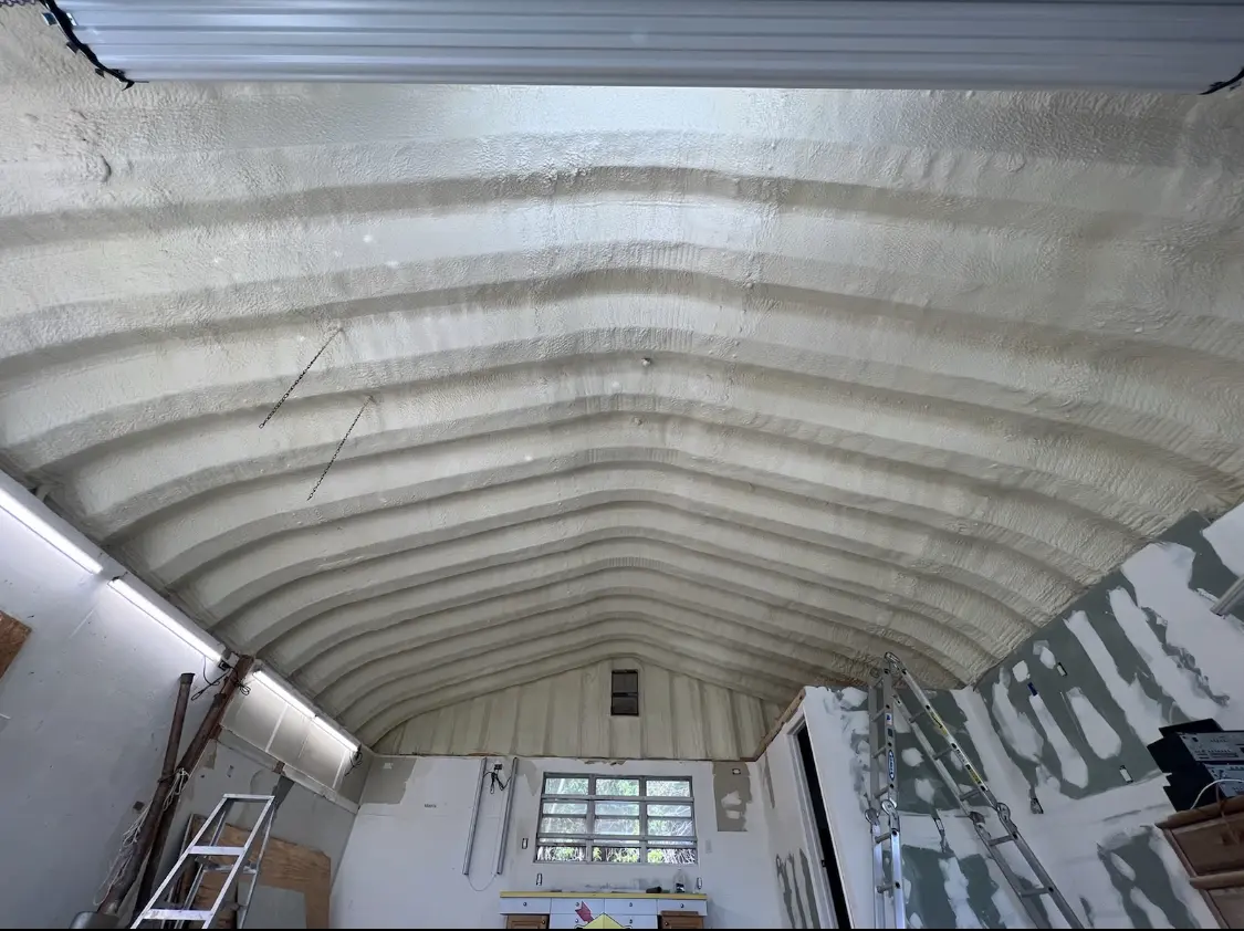 Spray polyurethane foam applied to the underside of a metal roof deck in Shiprock